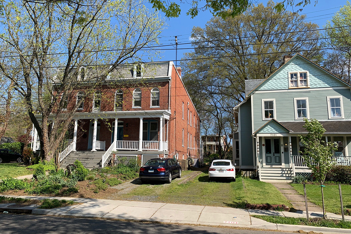 A duplex next to a single family home on a residential street