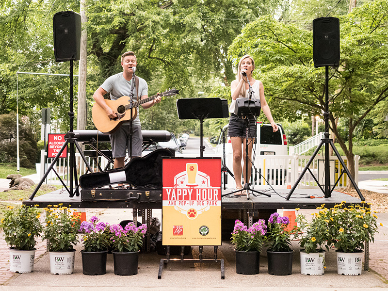 Musicians perform at Yappy Hour pop-up dog park in Bethesda