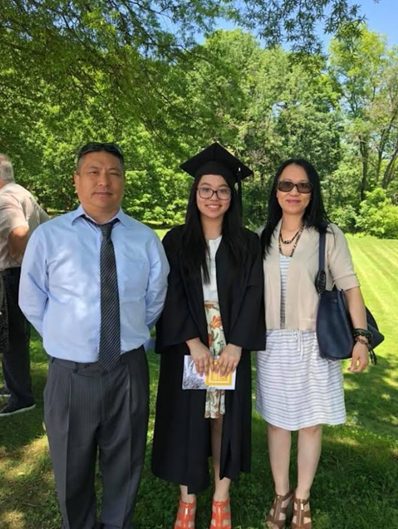 Karen Yee and her parents standing outside of the University of Maryland, Baltimore County’s event center.