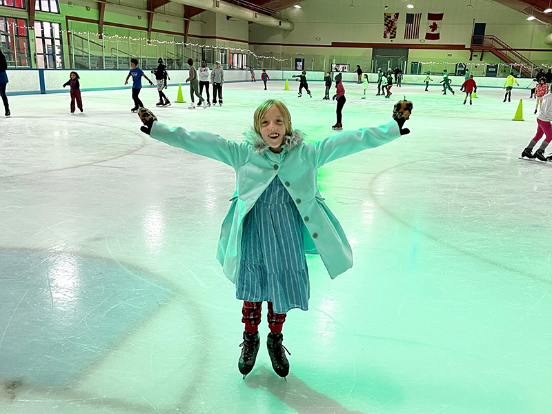 Girl on ice rink at Wheaton Ice Arena