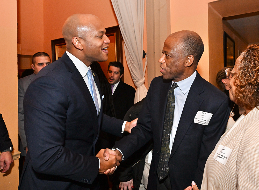 Governor Wes Moore and Montgomery Planning Board Chair Artie Harris shaking hands