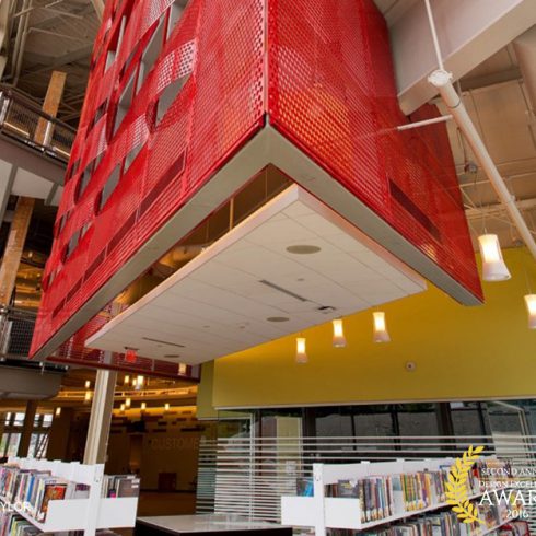 large red abstract artwork abover library stacks