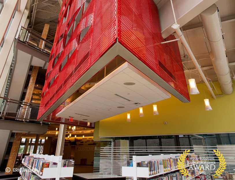 large red abstract artwork abover library stacks