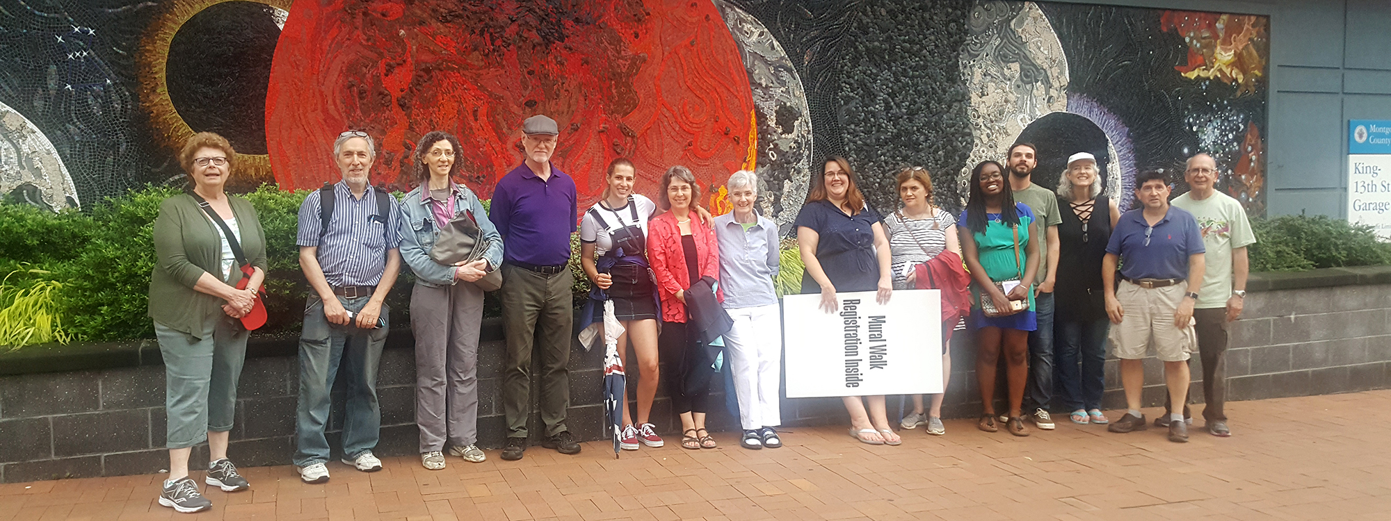 Participants in front of mural during Silver Spring Art Walk