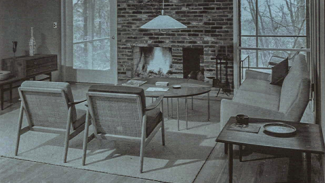 Black and white interior living room with fireplace 1960s home