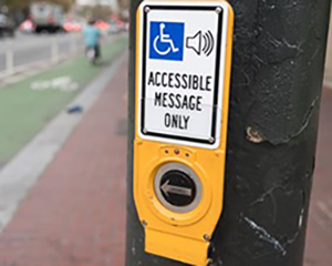An accessible pedestrian signal reads 