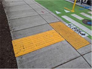 Example of a TWSI used in Montgomery County to direct people with vision disabilities to a floating bus stop.