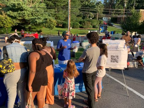 Community members visit Montgomery Planning table at an outdoor engagement event
