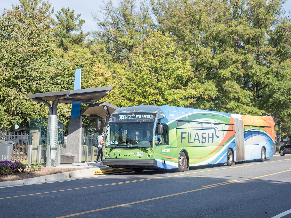 Flash bus pulls up to a bus stop
