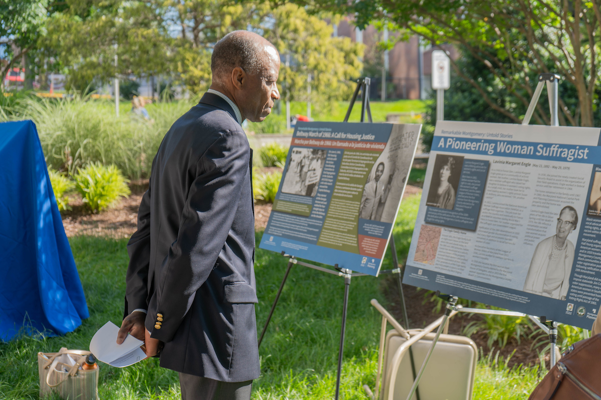 Plamnning Board chair Artie Harris takes closer look at historic marker