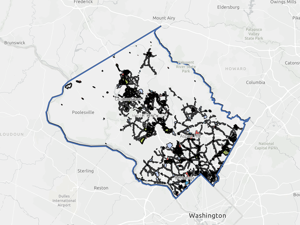 A map showing a county outlined in blue with black lines and dots indicating various locations and routes, overlaid on a regional map with labeled surrounding areas.