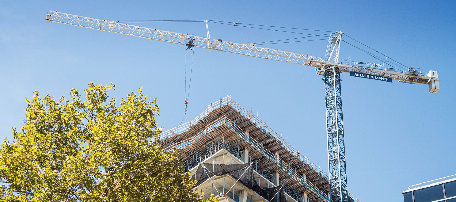A crane over a building being constructed